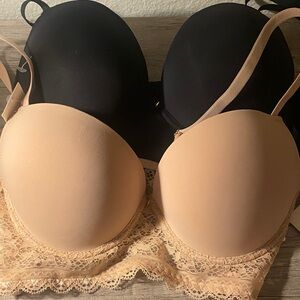 Elegant Lace Trimmed Black and Tan Bras